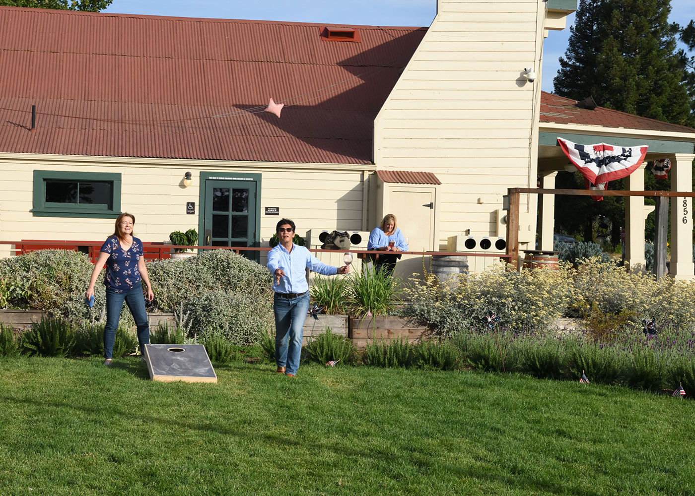 Oakville Grocery customers playing cornhole